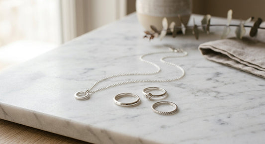 Elegant sterling silver jewelry on a neutral marble surface