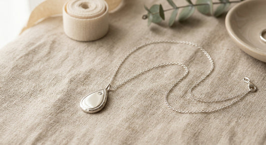 Elegant sterling silver teardrop pendant necklace on a neutral surface