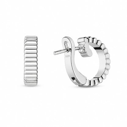 Pair of 925 sterling silver ribbed wide half-hoop earrings on white