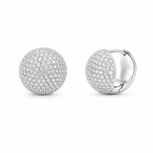 Front and three-quarter views of 925 sterling silver round pave dome huggie earrings on white