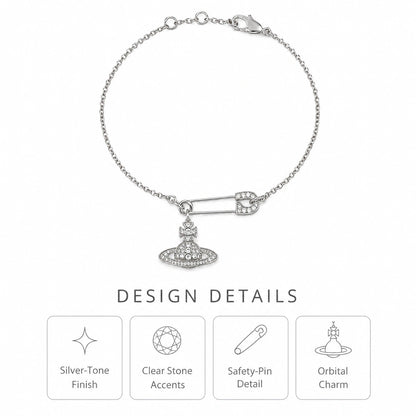 Design details of a silver-tone safety pin bracelet with clear stone accents and an orbital charm.