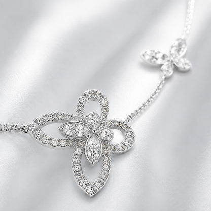 Macro detail of crystal butterfly motif and sterling silver chain