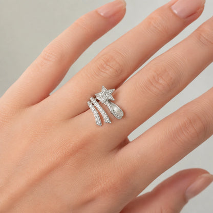 Shooting star wrap ring worn on a woman's finger in close-up