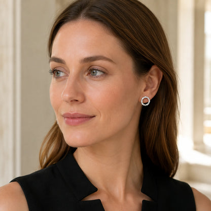 Lifestyle portrait featuring geometric open circle earrings in 925 sterling silver