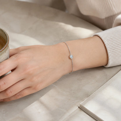 Minimalist silver crystal bracelet worn in a warm everyday setting