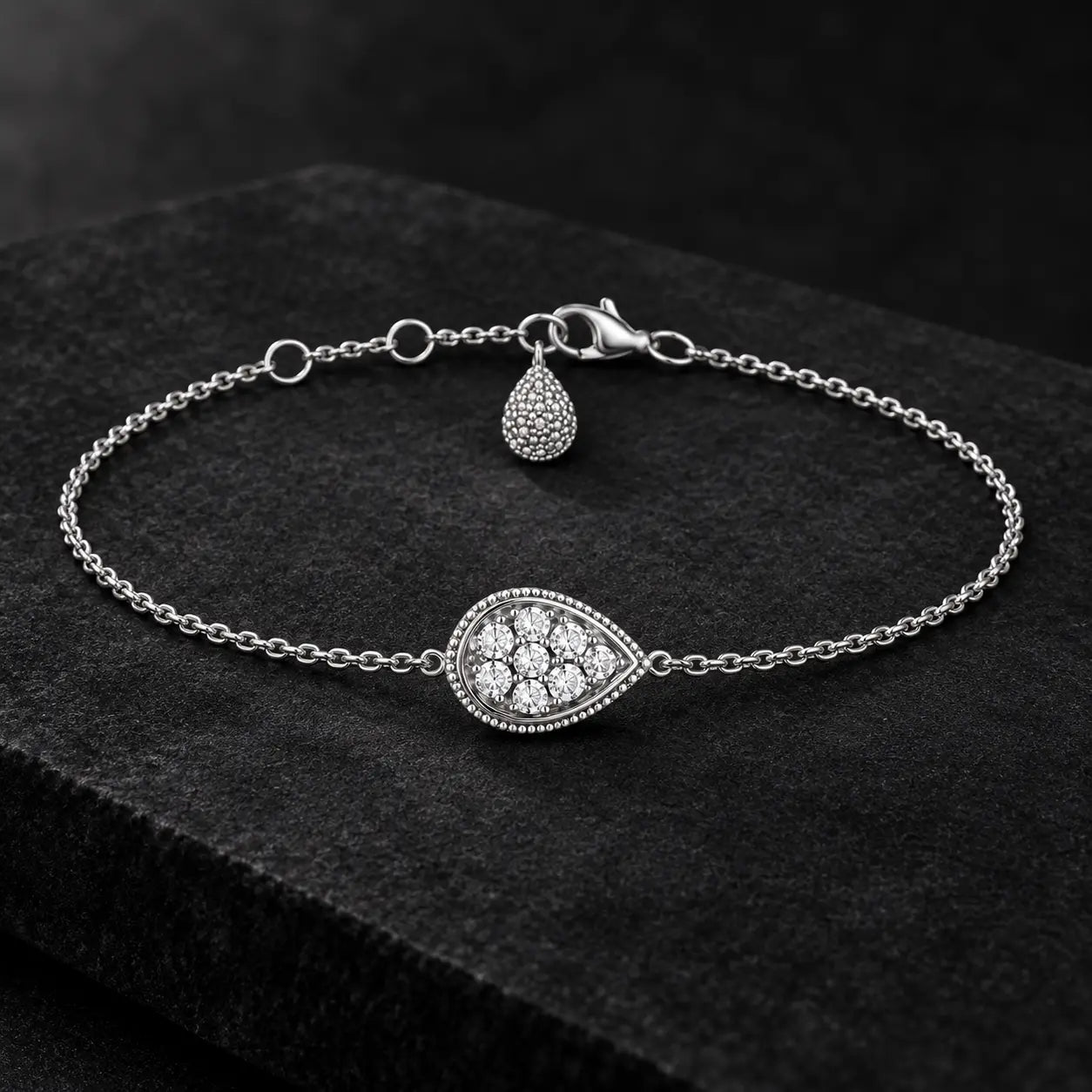 925 silver crystal teardrop bracelet displayed on a premium dark background.