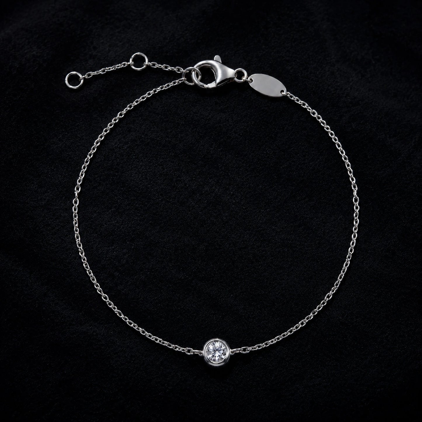 Sterling silver solitaire crystal bracelet displayed on black velvet