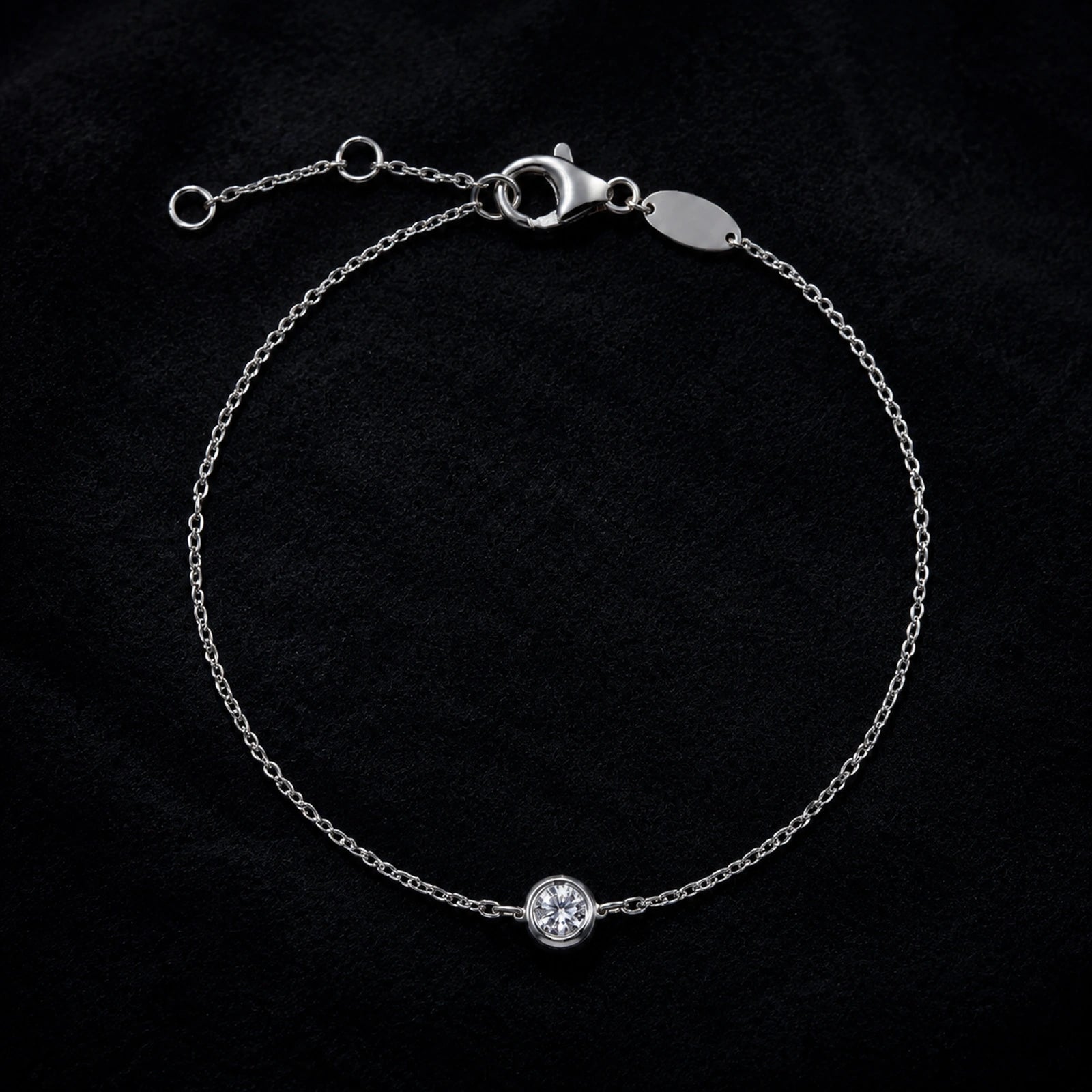 Sterling silver solitaire crystal bracelet displayed on black velvet