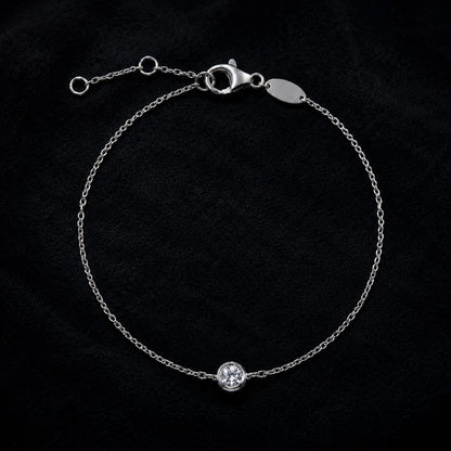 Sterling silver solitaire crystal bracelet displayed on black velvet