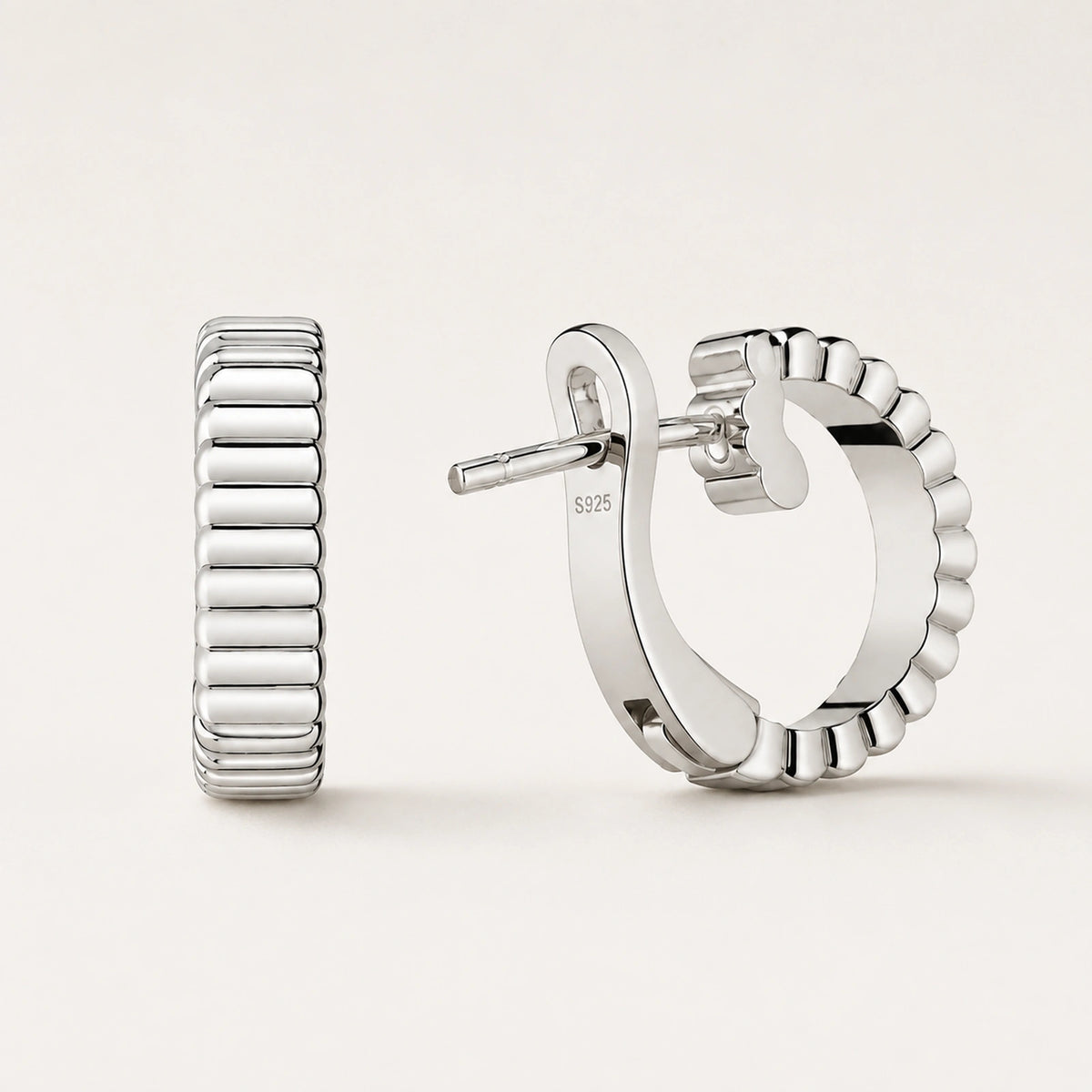Front and rear oblique views of ribbed wide half-hoop earrings