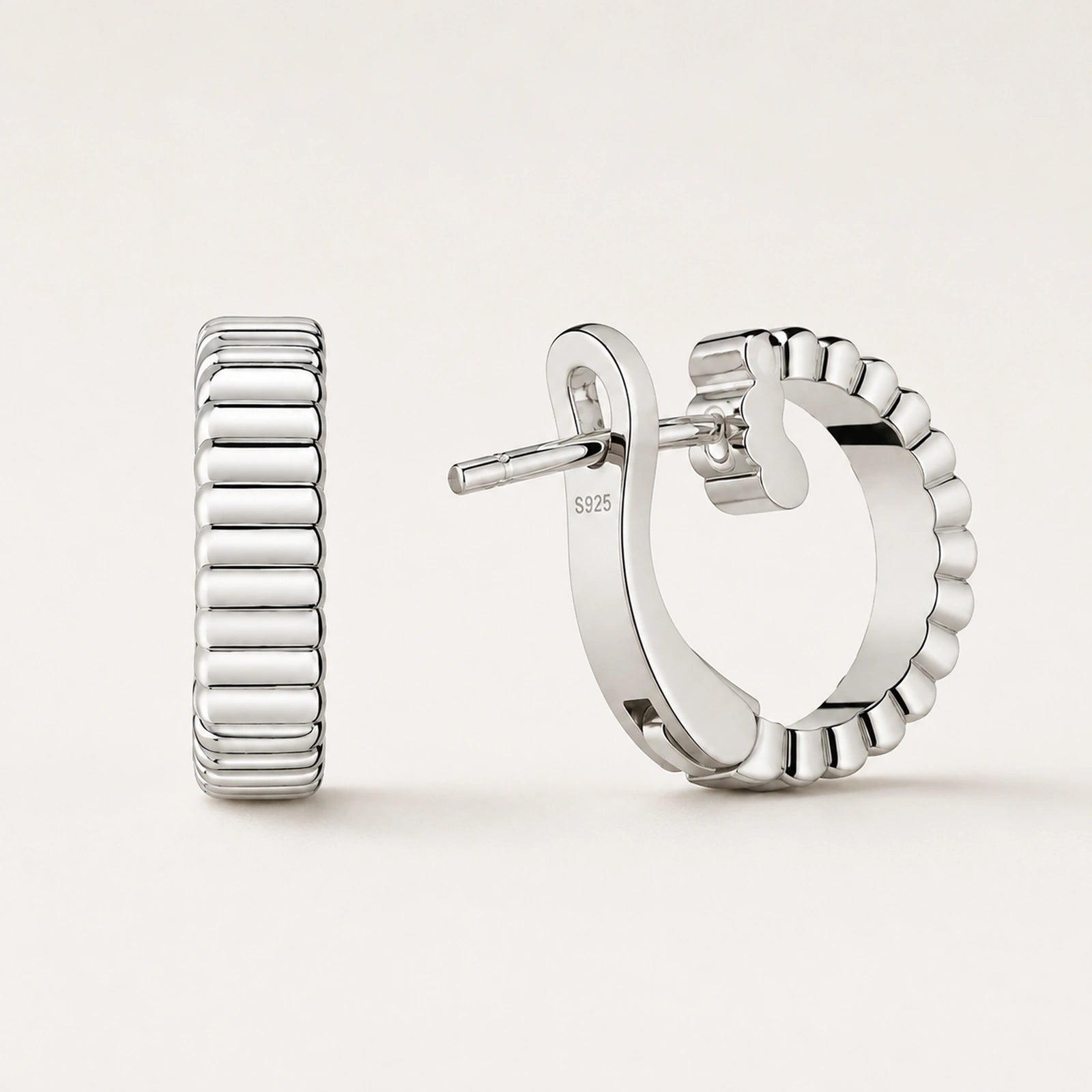 Front and rear oblique views of ribbed wide half-hoop earrings