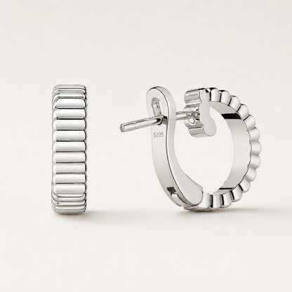 Front and rear oblique views of ribbed wide half-hoop earrings